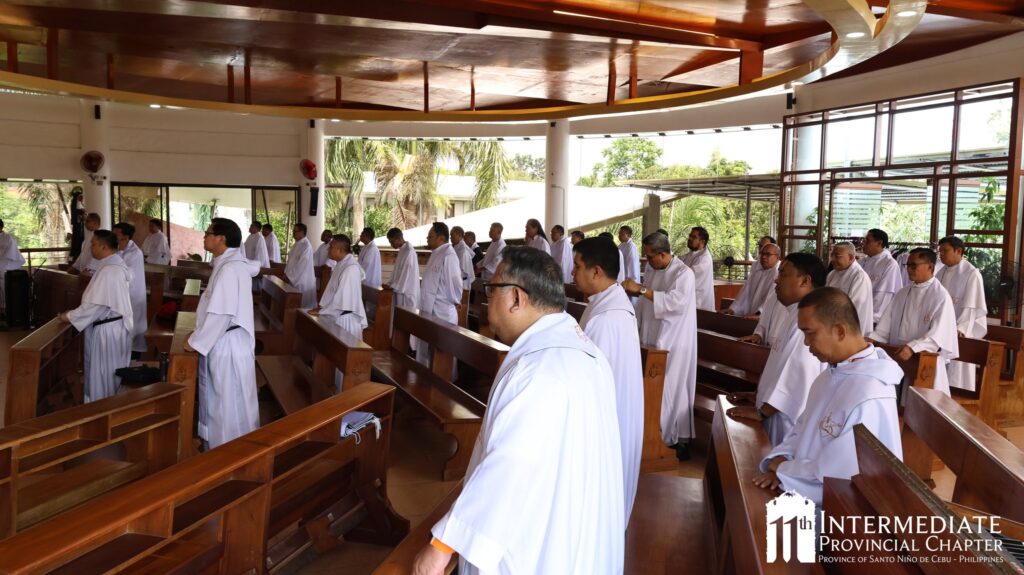 May be an image of one or more people, temple and text